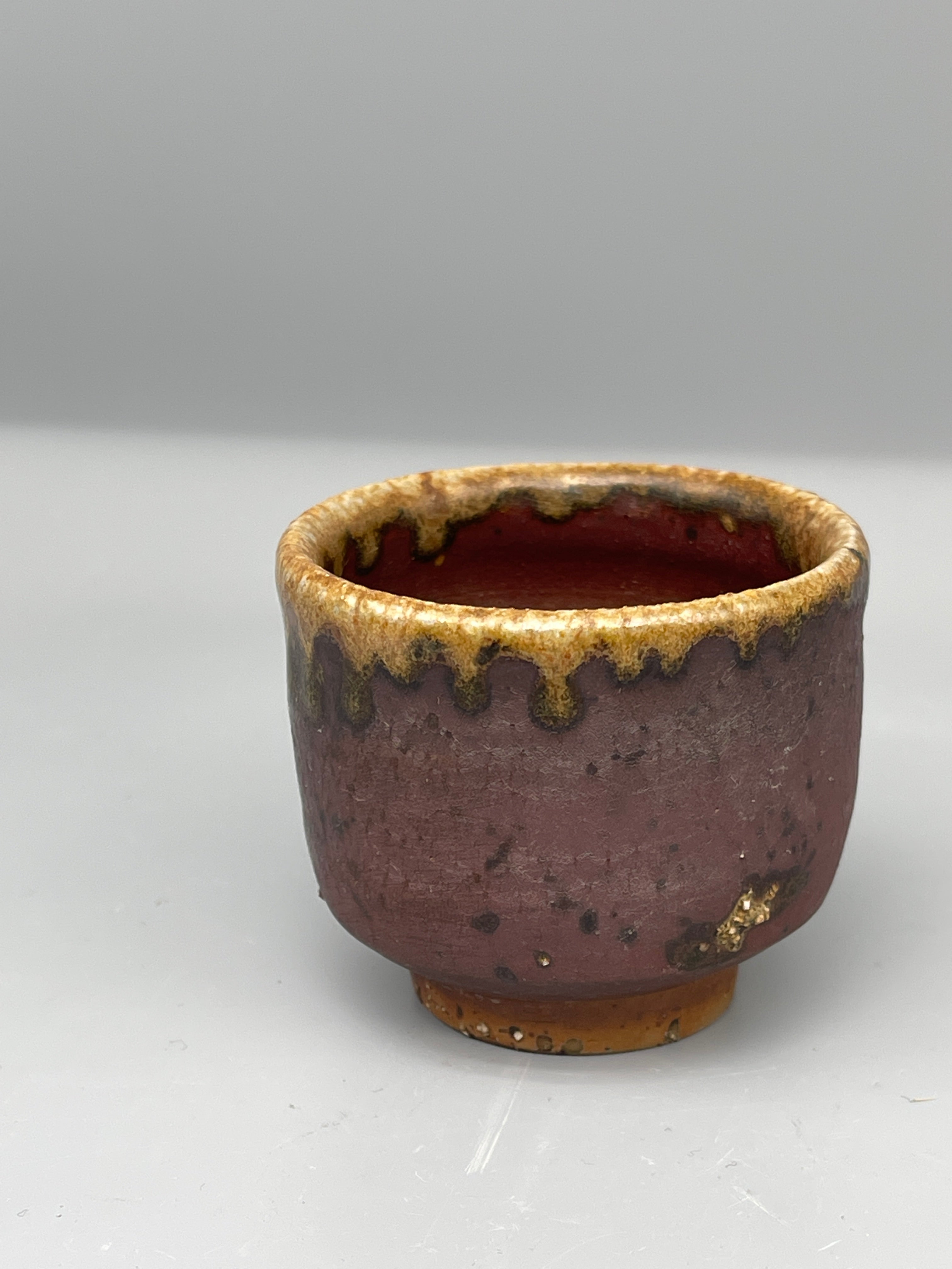 Vintage Japanese bizen guinomi cup, plum brown, interior view with yellow ash glaze