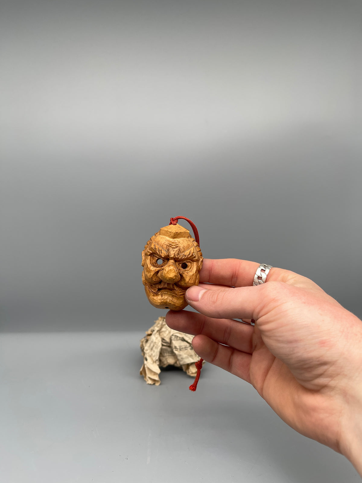 Vintage Japanese carved tengu mask, held view