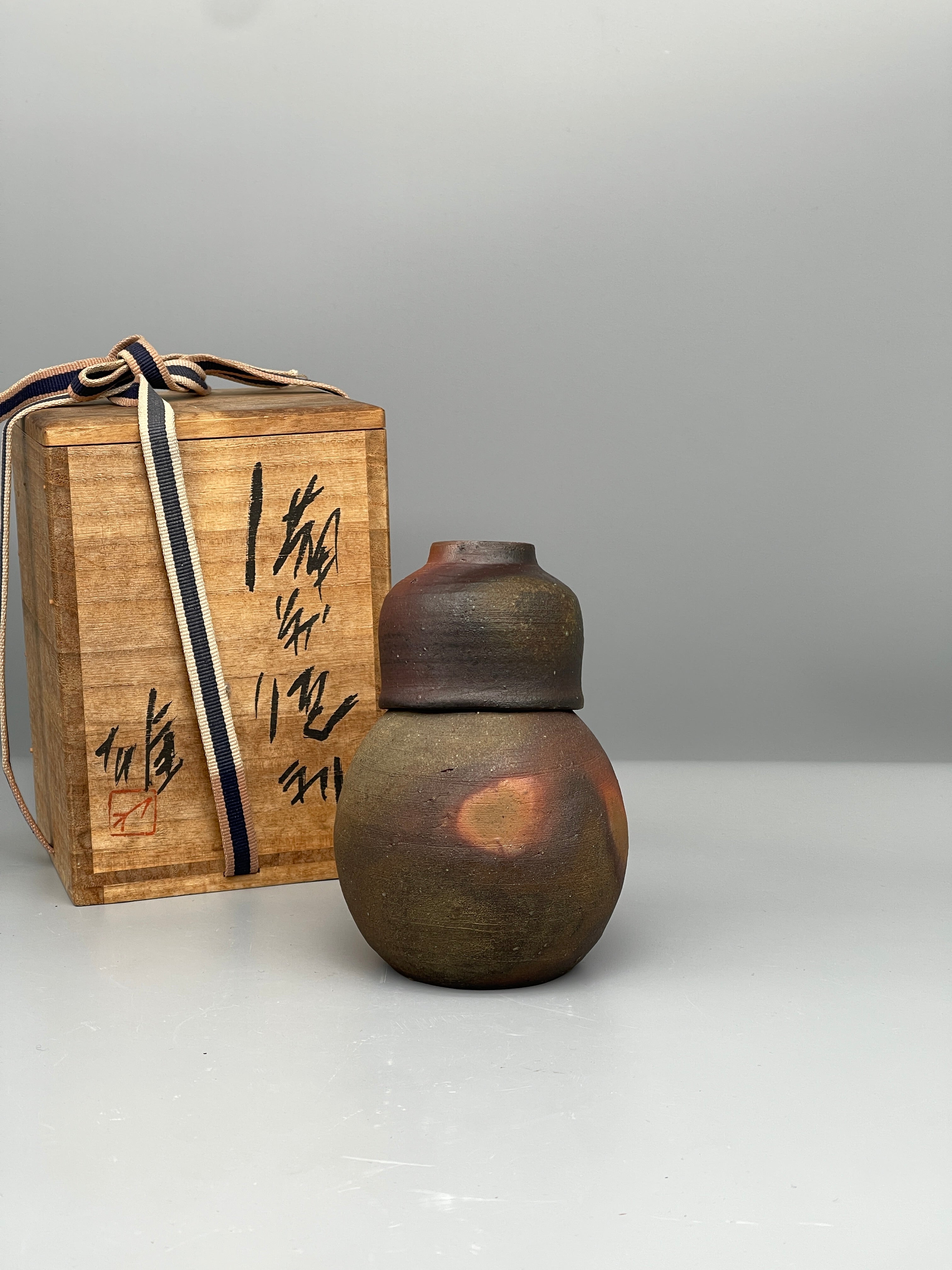 Vintage Japanese bizen sake bottle and cup, with box
