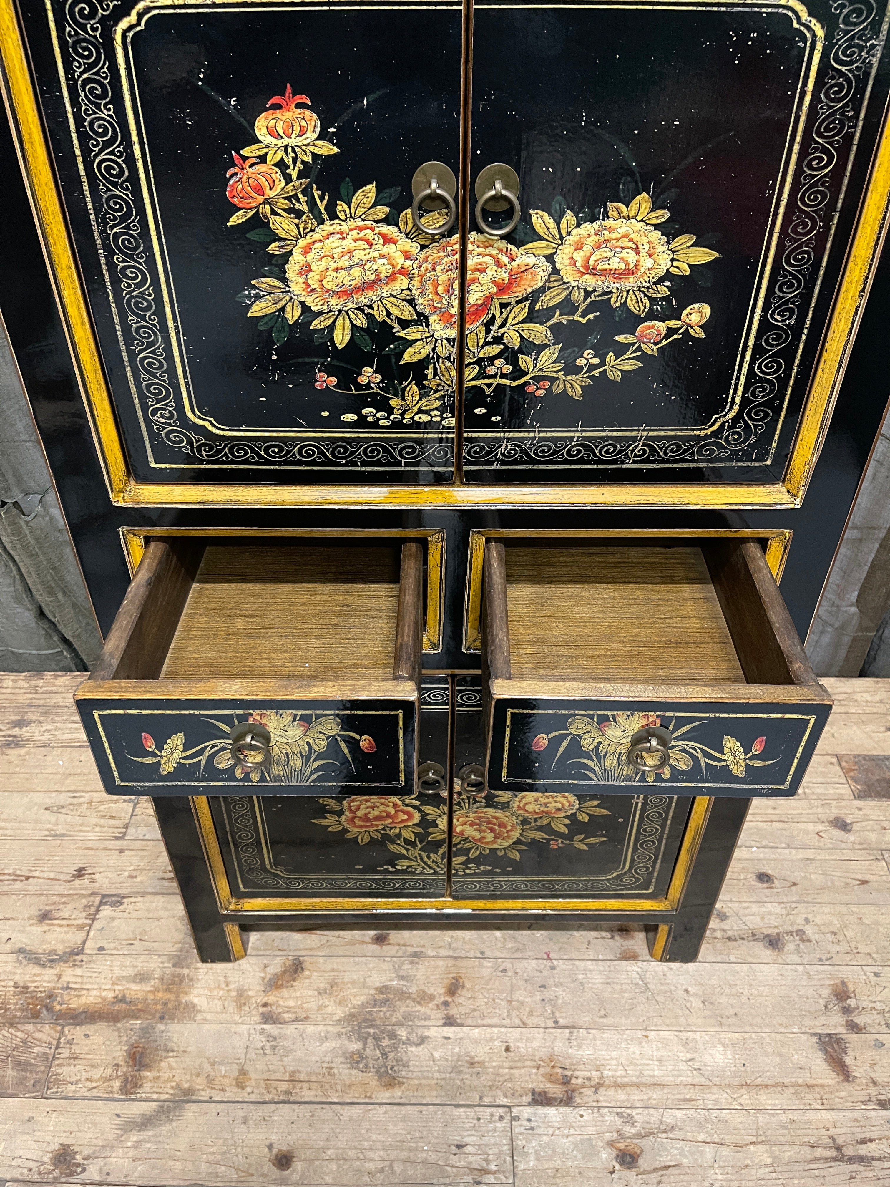 Chinese Black Lacquered Storage Cabinet, Gold Bordered Floral Panels