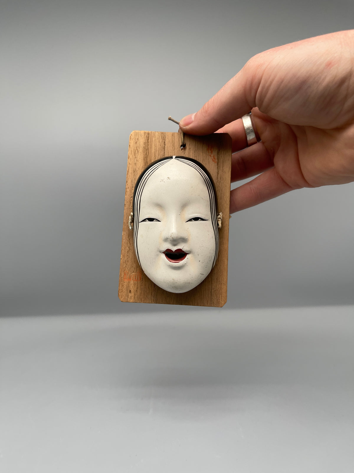 Vintage Japanese Noh mask, Ko-omote, held view