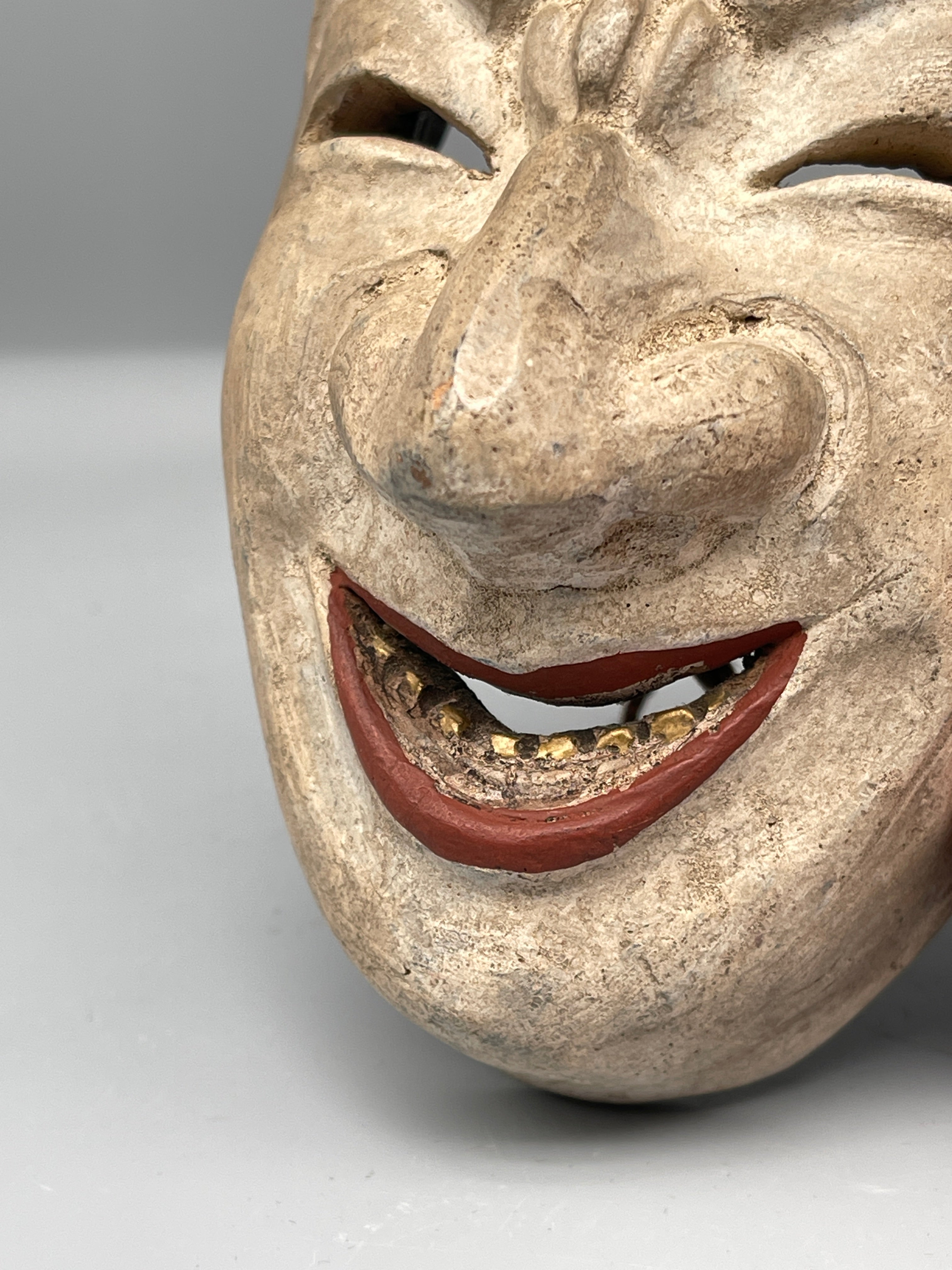 Vintage Japanese carved mask, aged finish, mouth detail