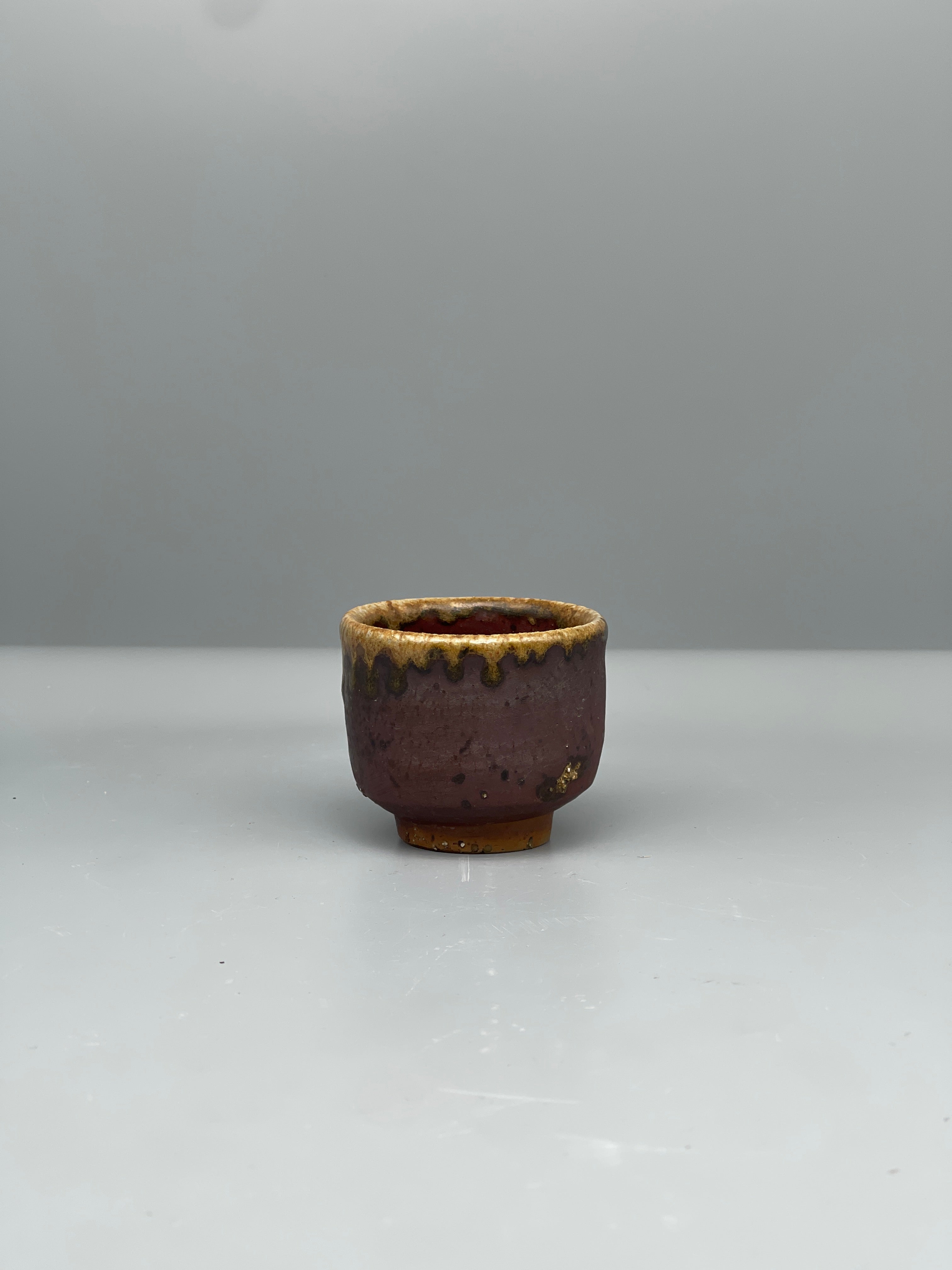 Vintage Japanese bizen guinomi cup, plum brown, side view