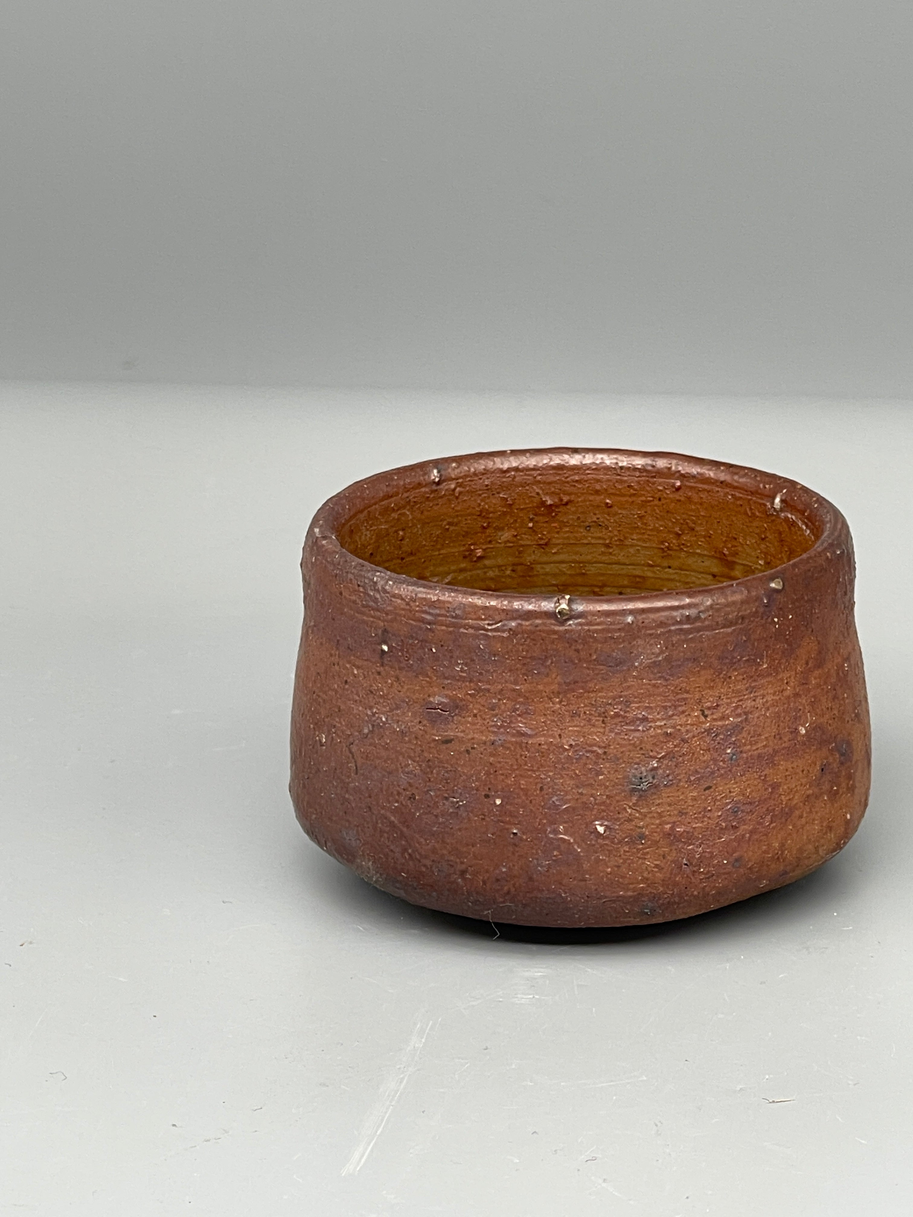 Vintage Japanese bizen guinomi cup, rust red, interior view