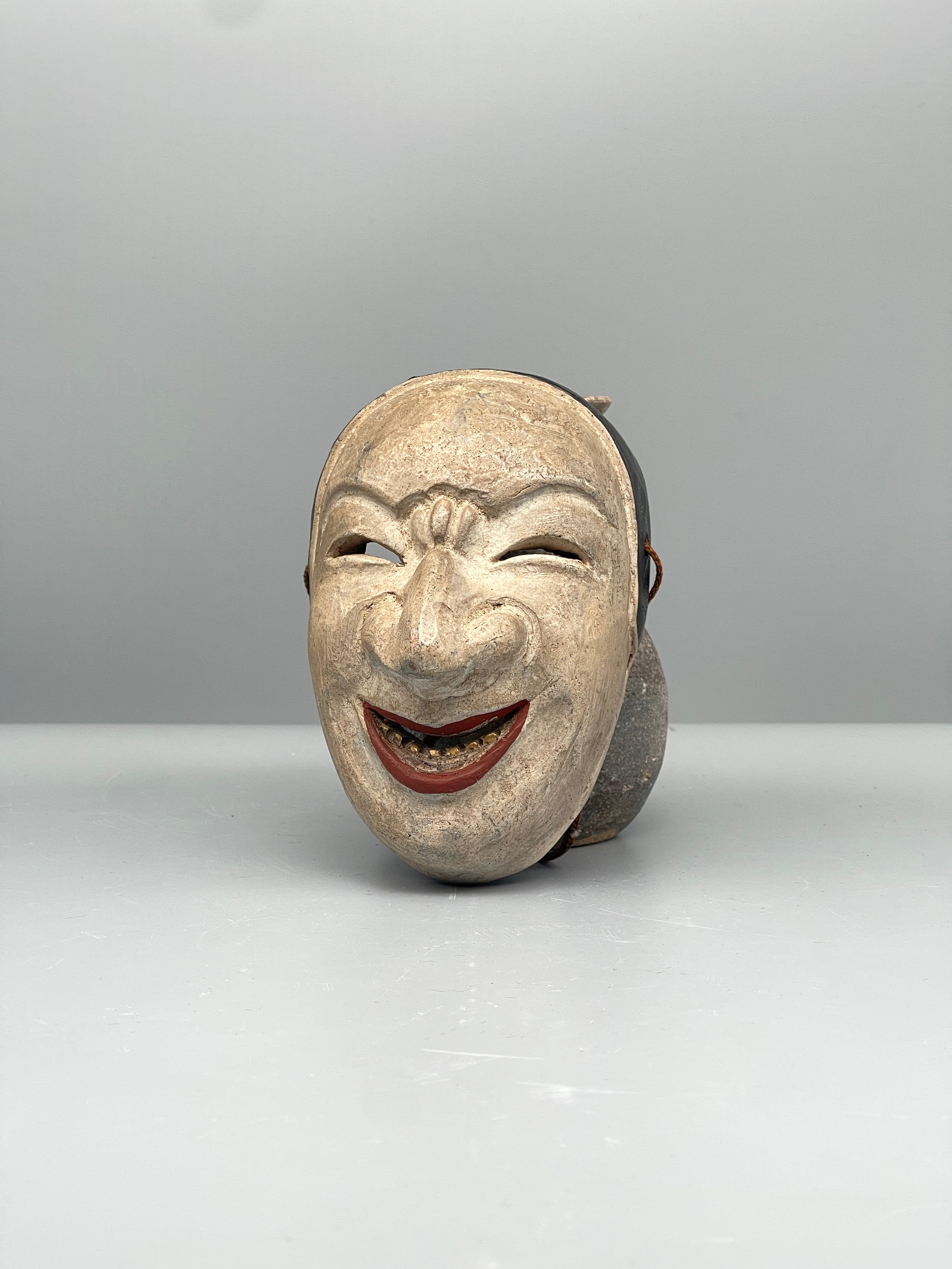 Vintage Japanese carved mask, aged finish, front view