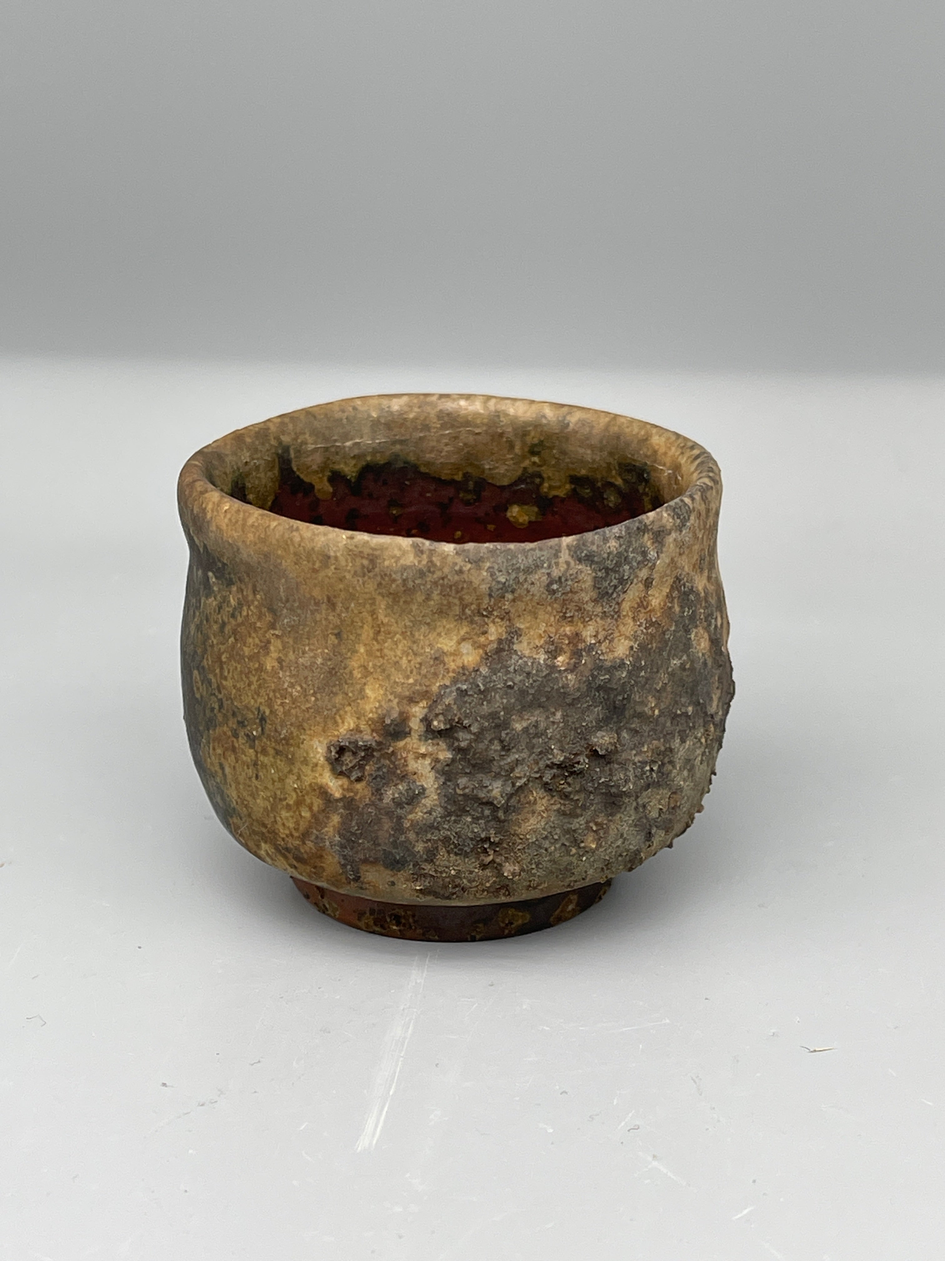 Vintage Japanese bizen guinomi cup, ash-crusted rim, interior view