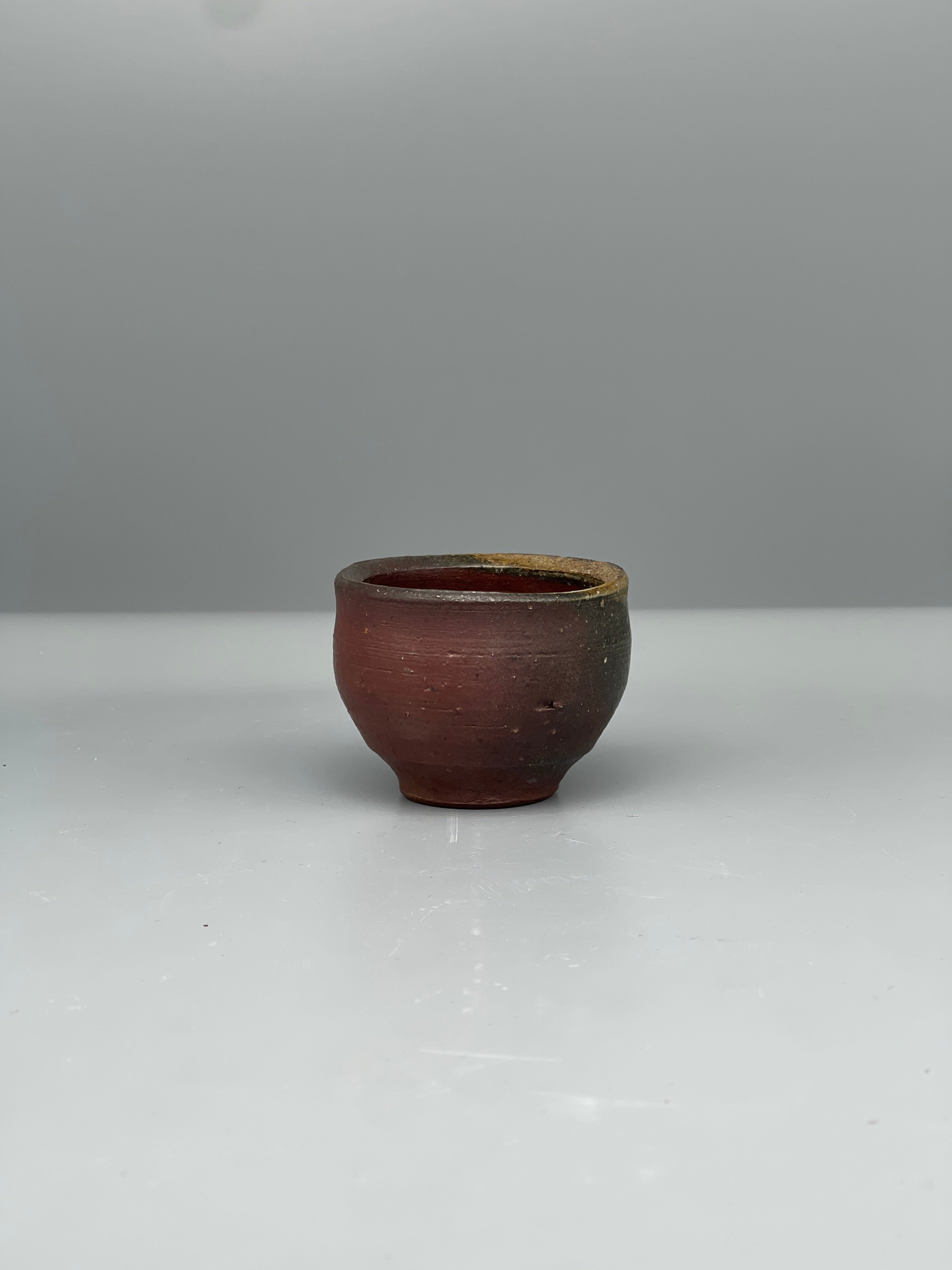 Vintage Japanese bizen guinomi cup, speckled red, side view
